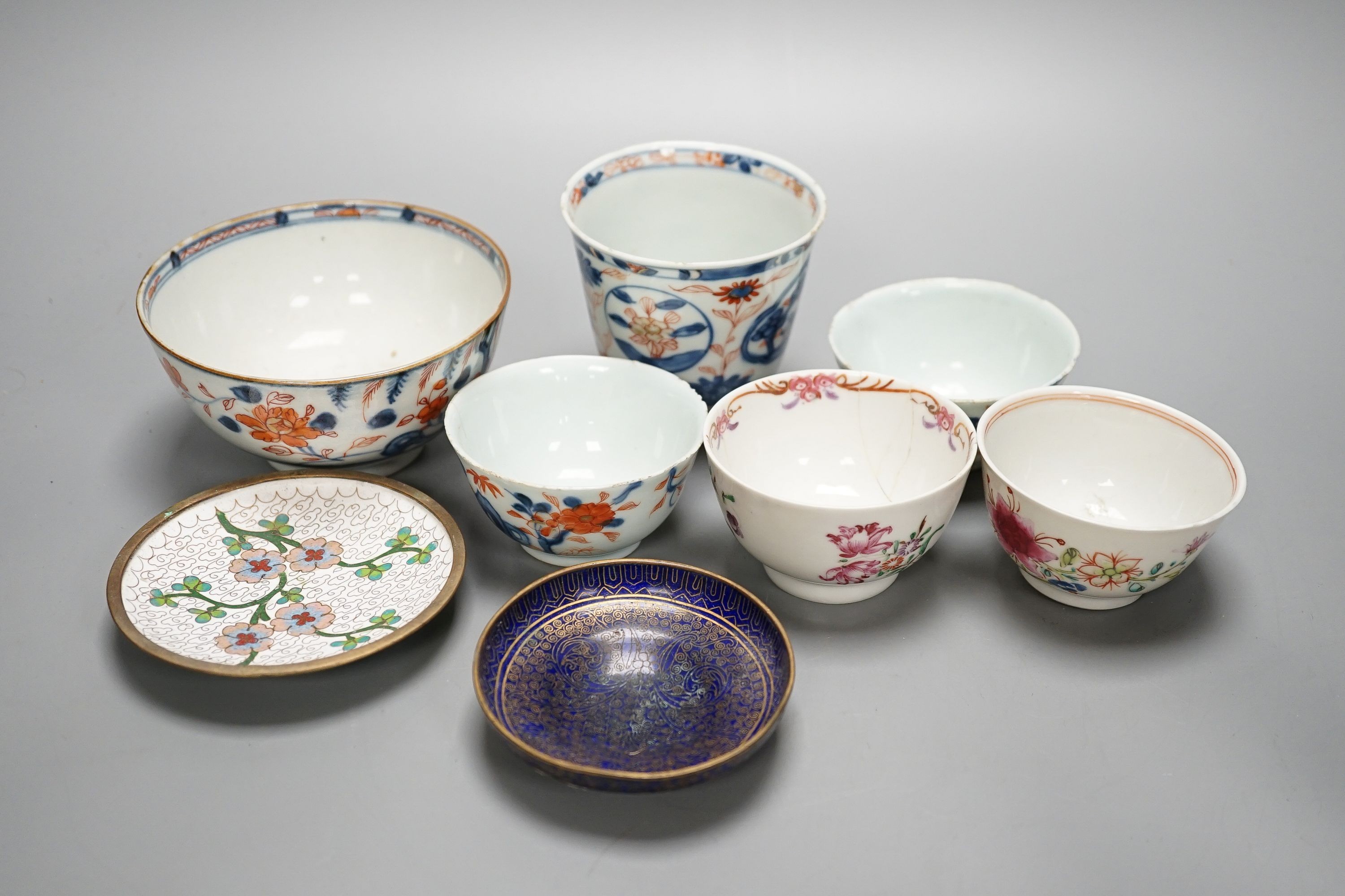 A collection of 18th century Chinese export porcelain tea bowls or cups and two cloisonné enamel dishes